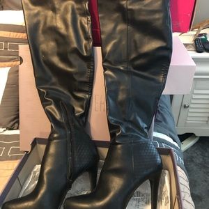 Jennifer Lopez over knee boots